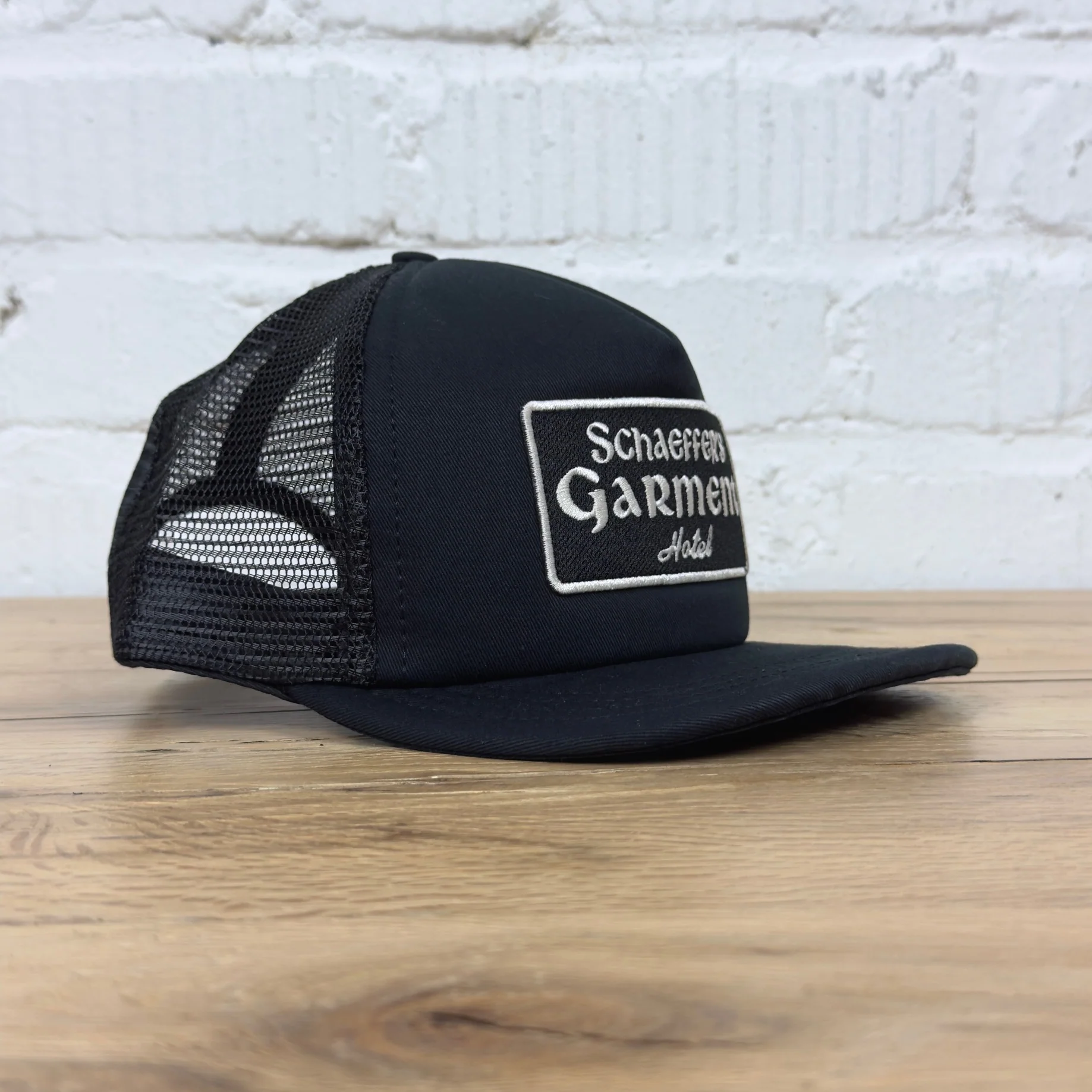 schaeffer's garment hotel | black chateau trucker hat